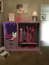 Super Cute And Easy Diy Dress Up Station Repurposed An Old Entertainment Unit Into Any Little Girl S Dream Dress Dress Up Stations Dress Up Storage Diy Dress