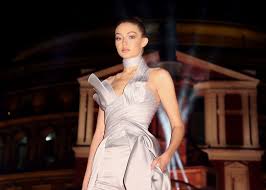 Gigi hadid has had a pretty busy schedule compared to most people over the past few days—she's modeled in what seems like a hundred runways since last wednesday for new york fashion week. Gigi Hadid In Silver Jumpsuit At The British Fashion Awards Gigi Hadid Cinderella Like Jumpsuit