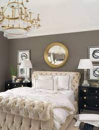 The appealing gold floral pattern on the wall brings interest in this bedroom, as well as the. Using Gray Color Scheme With Gold Accents And Decor
