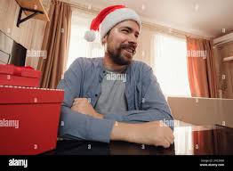 hipster man with red cup sitting home at Christmas time. Virtual Christmas  thanksgiving house party. Online team meeting video conference calling from home.  POV WEBCAM VIEW Stock Photo - Alamy