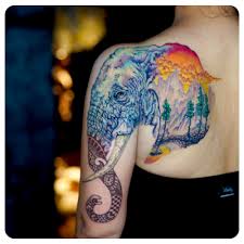 Colors have been splashed majestically across the center of the back to create an astounding masterpiece. Elephant Illustrative Watercolor Shoulder Tattoo Sacred Arts
