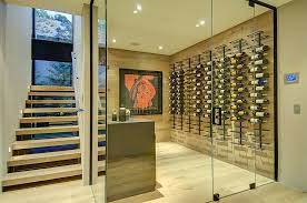 Expansive Wine Cellar Under The Staircase From Meridith Baer Home Glass Wine Cellar Wine Cellar Modern Wine Cellar Design