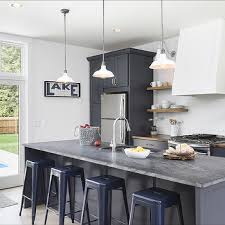 A stylish kitchen in white with a victorian feel and a navy ktichen island, skylights and pendant lamps highlight. Navy Kitchen Ideas Design Ideas