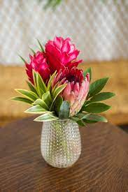 Wedding Flowers Pop Over To This Website Tropical Flower Arrangements Tropical Floral Arrangements Wedding Floral Centerpieces