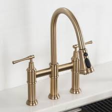 The universal design complements a range of décor styles, and pairs perfectly with any kraus kitchen faucet for a cohesive look. Kraus Allyn Transitional 2 Handle Bridge Kitchen Faucet With Pull Down Sprayhead In Brushed Gold Kpf 3121bg The Home Depot Kitchen Faucet Gold Kitchen Faucet Faucet