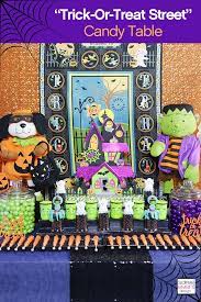How To Setup A Trick Or Treat Halloween Candy Table Halloween Candy Table Halloween Crafts Halloween Candy Buffet