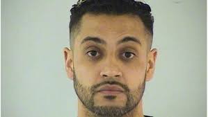 Former felon charged with illegally carrying weapon in northern suburbs