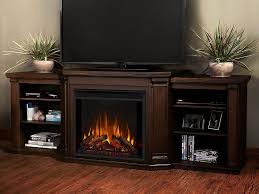 Electric fireplace tv stand entertainment center in white the calie media cabinet has a center shelf the calie media cabinet has a center shelf with a drop down glass door and dual side cabinets with glass doors and adjustable shelves. Real Flame Valmont Chestnut Oak Electric Fireplace 7930e Co Real Flame