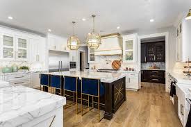 Traditional chrome and nickel knobs, as well as pulls, are no longer a popular design option. Royal Blue Counter Stools In White Kitchen Transitional Kitchen