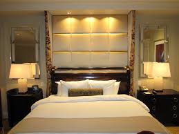 A limited palette of white, black, grey and soft red prevents the prints used in this bedroom from feeling overwhelming. Hotel Inspired Bedroom Ideas Whaciendobuenasmigas