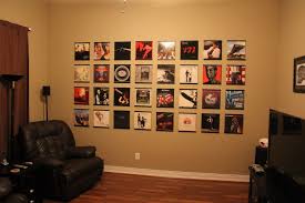 Sun shines from the top of the window in an old church with religious arts on the wall. Image Gallery Records On Walls
