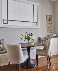 The table is a walnut veneer construction and the chairs are solid walnut frames. Gray Built In Dining Bench With Oval Wood Top Dining Table Transitional Dining Room