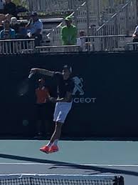 4k00:12young flirting girlfriend goes on evening meeting, romantic date to boyfriend standing on restaurant balcony, gently touches his back. Reilly Opelka At Miami Open Tennis