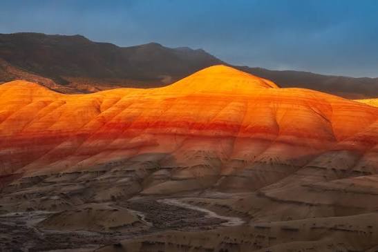 The Painted Hills in the John Day Fossil Beds National Monument Oregon. It  was a rainy day and then, just before the sun set over the horizon, this  happened. There was a