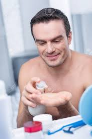 Skin Ambulance. Pleasant Joyful Merry Man Holding Lotion And Stretching  Palm While Grinning Stock Photo, Picture and Royalty Free Image. Image  91463811.