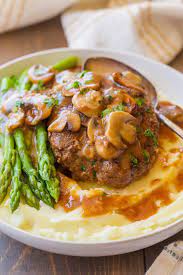 Most Tender And Juicy Salisbury Steak In A Rich And Creamy Mushroom And Onion Gravy Salisburysteak Easy Steak Recipes Salisbury Steak Recipes Salisbury Steak