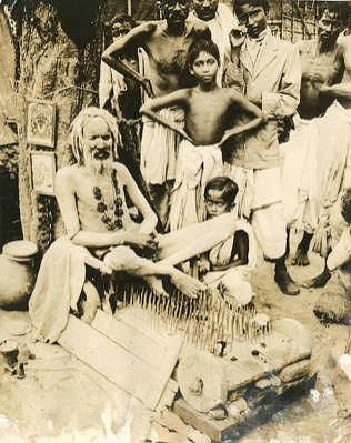 Fakir on a bed of nails in Calcutta, India"
