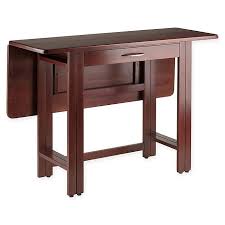 This dining table is made of strong acacia wood, which makes it very stable and durable. Winsome Taylor Drop Leaf Dining Table With Walnut Finish Bed Bath Beyond
