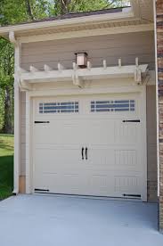 Pergola canopy kit above garage door.you could also look for pergola kits that feature a removable canopy to let a little sun in. Pin By Annice Broadwell On Home Decor And Storage Ideas Garage Door Design Door Pergola Garage Decor