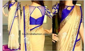 Black And Gold Combination Blouse Designs Absolutely Love The Cream Navy And Gold Colour Combination And That Gorgeous Blouse Netted Blouse Designs Trendy Blouse Designs Blouse Design Models