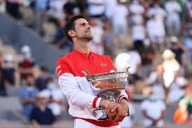 Novak djokovic shakes his head at lorenzo musetti's brilliance after another thrilling point. 2uchmy17i Basm