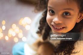 Girl Leaning On Desk High-Res Stock Photo