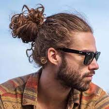23 Best Man Bun Styles 2021 Guide Man Bun Curly Hair Long Curly Hair Men Man Bun Haircut