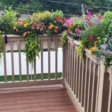 The simple stripping of the box is a great fit when you are not looking for fancy mouldings, but want a window box with some different depths and texture. 42 New Age Modern Self Watering Deck Railing Planter Over The Rail In 2021 Deck Planters Railing Planters Balcony Planters