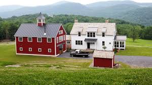 A yankee barn carriage house combines elegant, energy efficient living quarters and vehicle storage space in to a single structure. The Eaton Post And Beam Carriage House American Traditional Exterior Manchester By Yankee Barn Homes