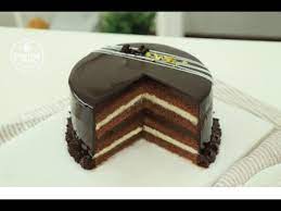 This cake recipe looks simple, not requiring a variety of ingredients, but can be quite challenging in creating the perfect sponge. Chocolate Indulgence Cake Recipe Cotton Soft Chocolate Cake Chocolate Glaze Youtube