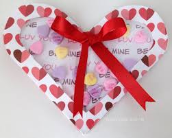I created the trio of medallions with a combination of one of the baroqe motifs images, along with punched cardstock flowers done with the spring bouquet punch, and a vellum flower punched with the three for you punch. Purple Hues And Me Handmade Valentine Acetate Hearts Folding Card