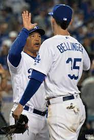 Los Angeles Dodgers Manager High Fives First Baseman Cody Bellinger After Beating The Chicago Cubs In Game 1 O Dodgers Bellinger Dodgers Baseball Jersey Outfit