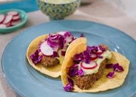 Remove the cooked fish from the grill to a platter, surround with lime wedges, serve with warm tortillas, hot sauce, sliced cabbage and sour cream. Coffee Rubbed Fish Tacos