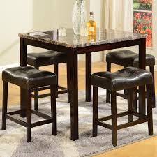 It's crafted from a mix of solid and engineered wood in a light brown and espresso hue that blends in easily with any color palette. Kinsey Marble Finish Counter Height Table And 4 Bar Stools 299 00 Table 36 Kitchen Table Settings Counter Height Dining Sets Bar Height Kitchen Table