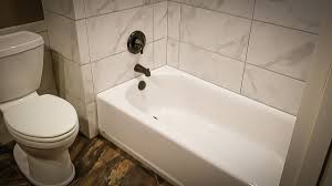 What differentiates a regular tub from a soaking tub is the depth and volume of water it can with an alcove soaking tub you can choose to tile down over the flange to seal the edge so water doesn't get between the tub/shower and the wall. Tile Setting How To Set Tile Around Your Tub Youtube