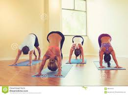 People Practicing Downward Dog Pose In Yoga Class Stock Image Image Of Meditation Natural 58316727