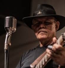 What is the correct way to string a guitar?