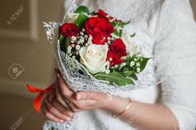 Just wedding flowers specialises in stunning fresh and silk flowers for weddings and events. Wedding Bouquet Of Red Roses In Bride S Hands With Beautiful Stock Photo Picture And Royalty Free Image Image 55067343