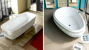 A bathtub and shower combo is great if you are looking to maximize the amount of bathroom space you have. Bathroom Decor Escape Into A Marble Wonderland With These 9 Unique Bathtub Designs Architectural Digest India