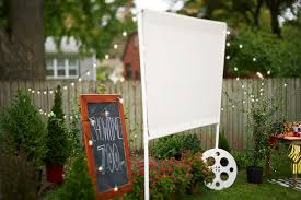 Use a dropdown curtain hanging from a clothesline for indoor and outdoor use. How To Build An Outdoor Movie Screen For The Best Backyard Hangout Better Homes Gardens