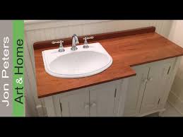 Wooden counter top and storage that coated in glossy black finish; How To Make A Wooden Vanity Top Countertop Youtube