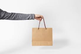 Hand Holding Blank Brown Paper Bag For Mockup Template Advertising And Branding On Gray Background Brown Paper Bag Gray Background Bag Mockup