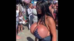 Woman with enormously oversized breasts turns heads at Venice Beach