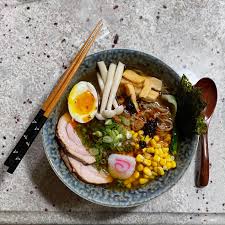 It's tacky, it's bright red, it's made with ketchup, but it's good. Shoyu With Pork Loin Chashu Menma Sweet Corn Mushrooms Tamago Fish Cake Chili Oil Crushed Crispy Chicken Skin Nori Scallions Ramen