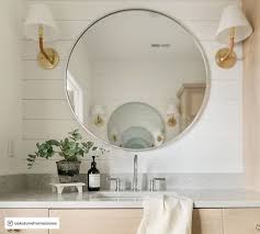 Whether you're looking to make a tight space feel larger or just want to add a little bit of shine to the room, reflective surfaces do the trick. Vintage Round Mirror Pottery Barn