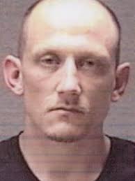 Police: Fleeing felon had heroin, handgun