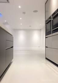Poured Resin Creates A Chic Minimal Finish For Kitchen Floors Our Resin Floors Are Soft To Touch D In 2020 Concrete Kitchen Floor Polished Concrete Kitchen Flooring