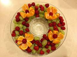 1 large pineapple 1 bunch green grapes—cut in half or quartered 1 bunch red grapes—cut in half or quartered 1 container strawberries—cut in half 1/4 watermelon toothpicks cookie cutters. Christmas Fruit Platter Christmas Veggie Tray Christmas Food Christmas Party Food