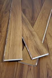Texture is coarse, uneven and oily to the touch, sometimes with a white glistening deposit. Burmese Teak Exotic Hardwood Flooring Lumber