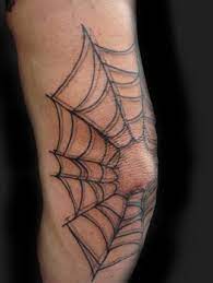 The spiderweb tattoo has a lot of different meanings but is most often associated with a criminal tattoo signifying the process of doing time in prison. Spiderweb Elbow Tattoo Tatouage Web Tatouage Du Genou Tatouage De Toile D Araignee